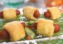 Cuisine Innovations Puff Pastry Wrapped Cocktail Beef Franks -- 100 per case.